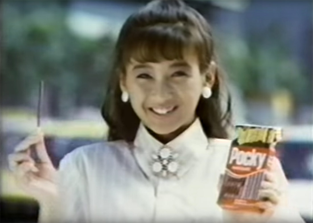 a woman eating pocky in a 1986 commercial