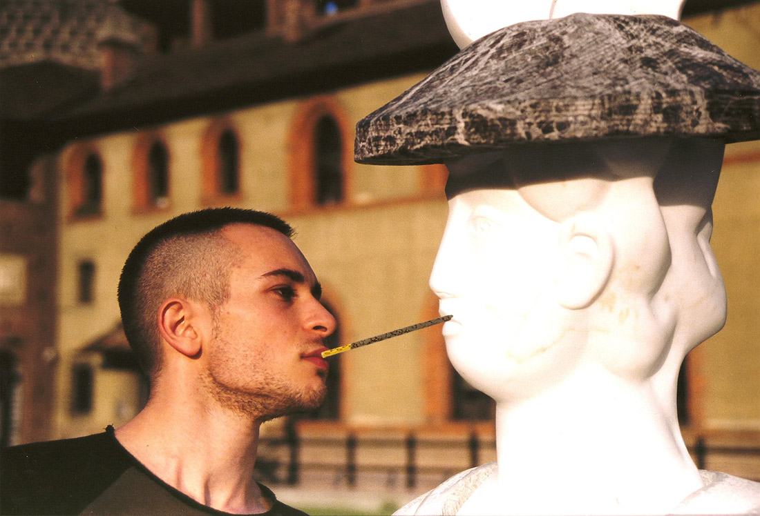 a young man and a statue playing the pocky game on pocky day